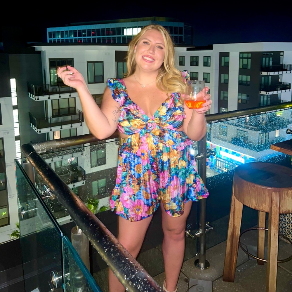 Size L floral romper with open tie back